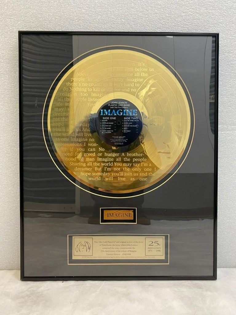 John Lennon gold record